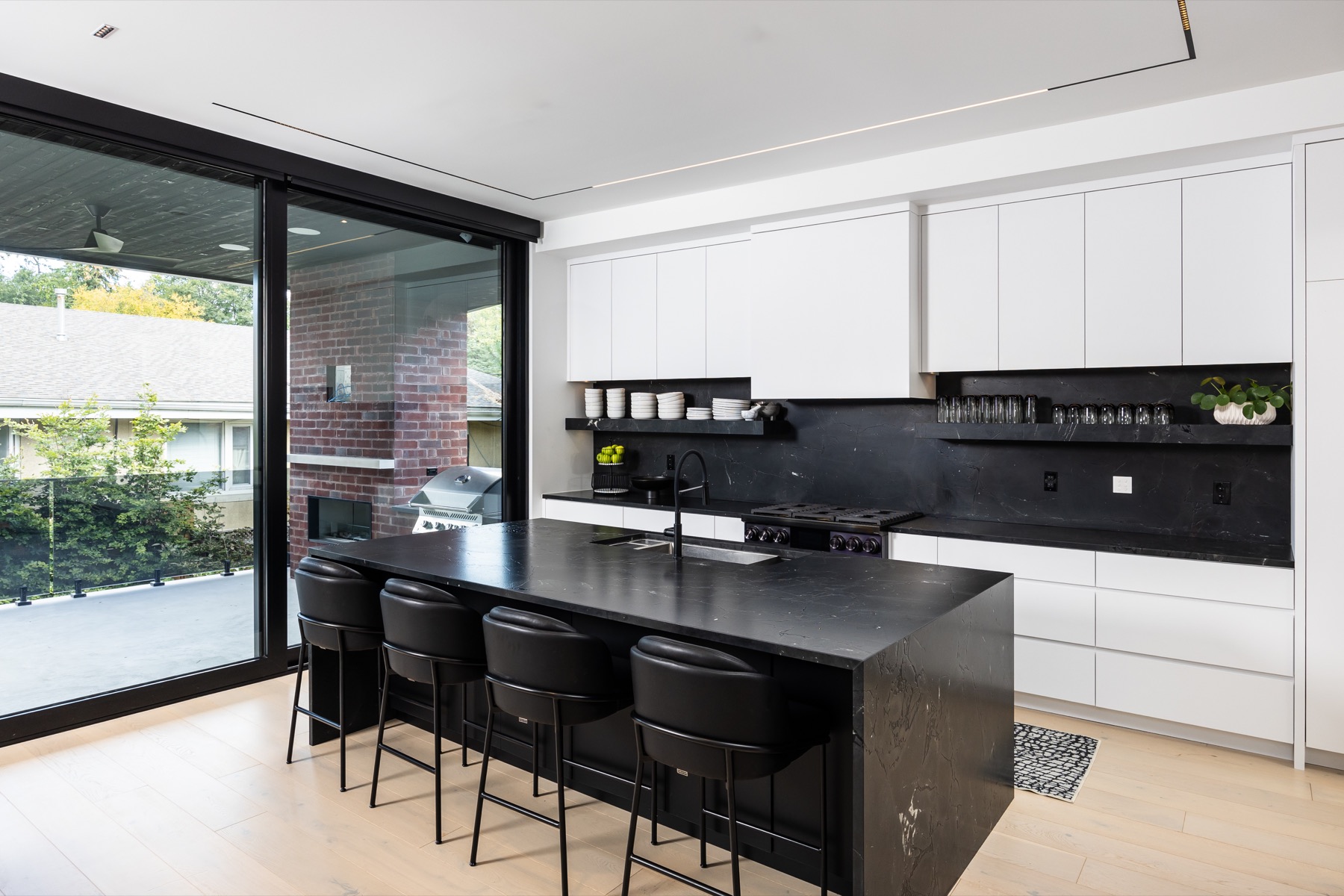 Ashton Manor kitchen with linear ceiling lighting and illuminated cabinetry